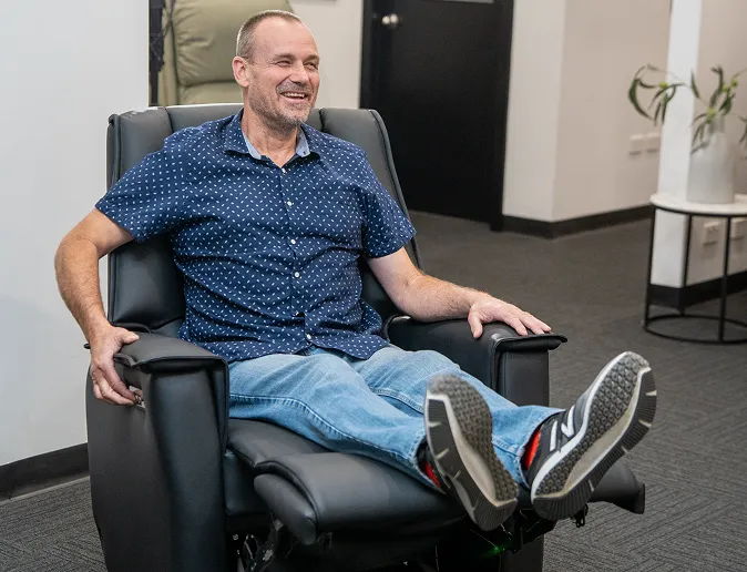 Person sitting in a Posture Care Chair recliner